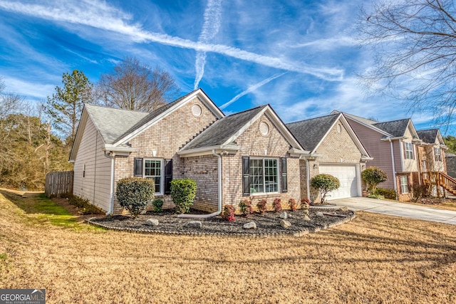 view of front of house featuring a garage and a front lawn