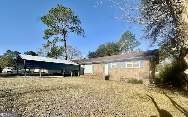 exterior space with a carport and a front lawn