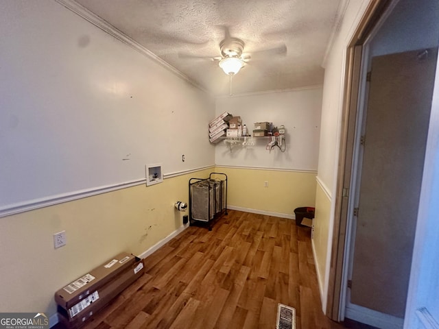 laundry area with hardwood / wood-style flooring, ceiling fan, washer hookup, ornamental molding, and a textured ceiling