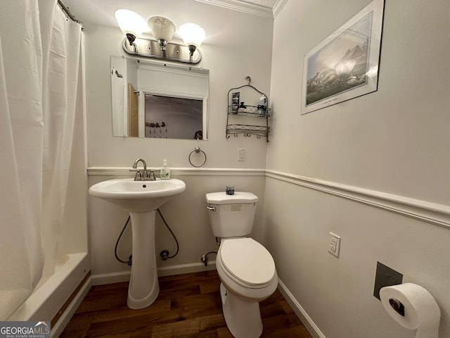 bathroom with shower / tub combo with curtain, toilet, and hardwood / wood-style floors