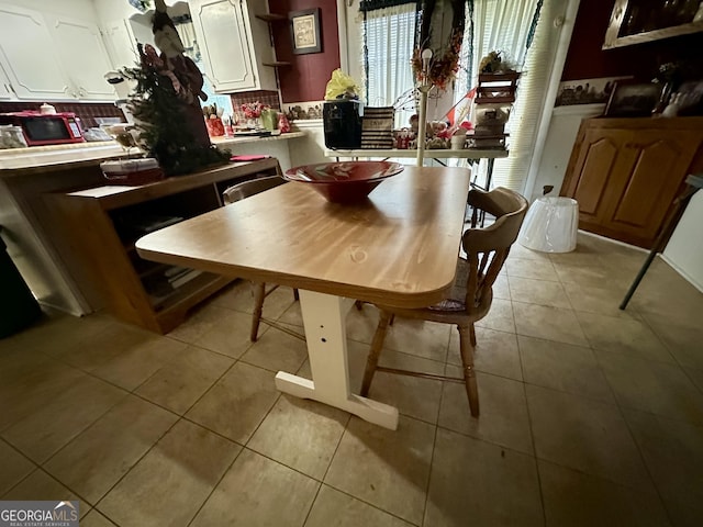 dining space with light tile patterned flooring