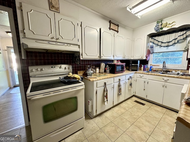 kitchen featuring sink, white cabinets, white range with electric cooktop, crown molding, and a textured ceiling