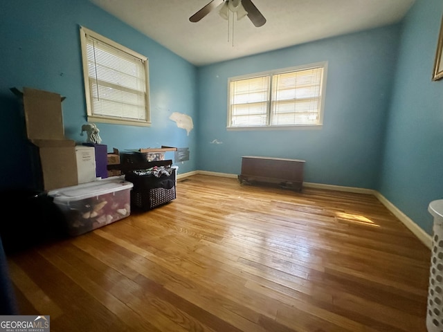 interior space with ceiling fan and light wood-type flooring