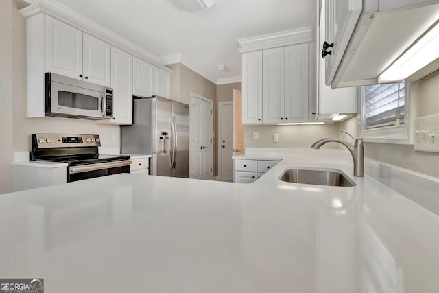 kitchen featuring sink, ornamental molding, white cabinets, and appliances with stainless steel finishes