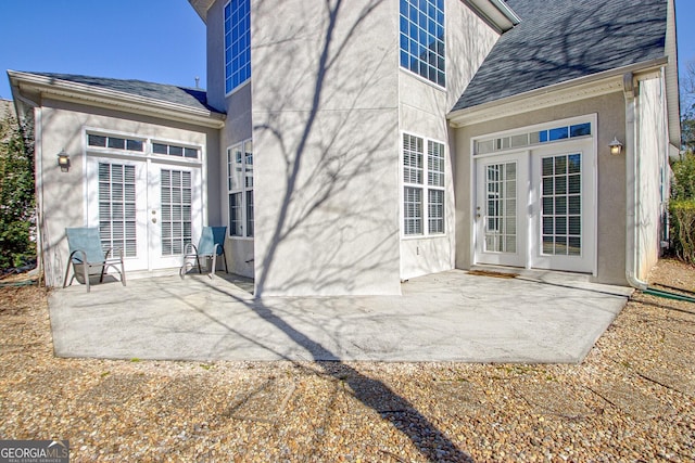 entrance to property with a patio and french doors