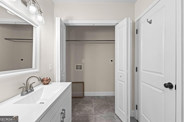 bathroom featuring tile patterned floors and vanity