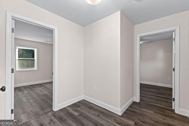 empty room featuring dark wood-type flooring