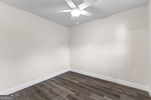 empty room with dark hardwood / wood-style floors and ceiling fan