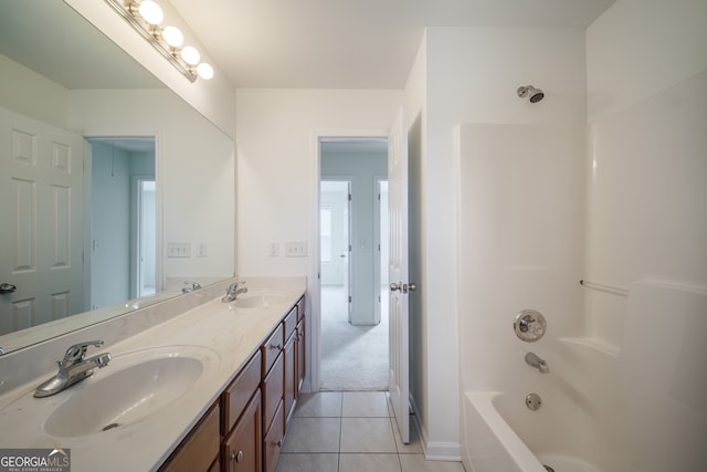 bathroom featuring vanity, tub / shower combination, and tile patterned floors