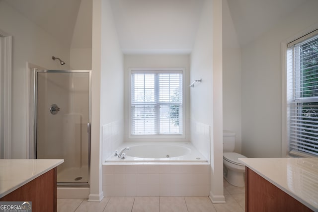 full bathroom featuring tile patterned floors, vanity, plus walk in shower, and vaulted ceiling