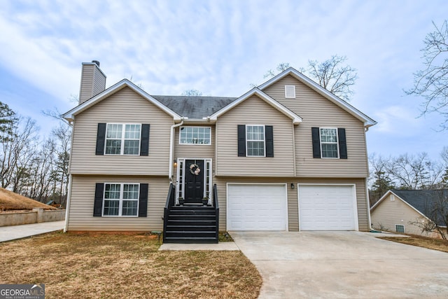 raised ranch featuring a garage