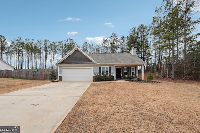 view of front of house with a garage and a front lawn