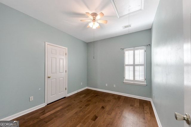 empty room with dark wood-type flooring