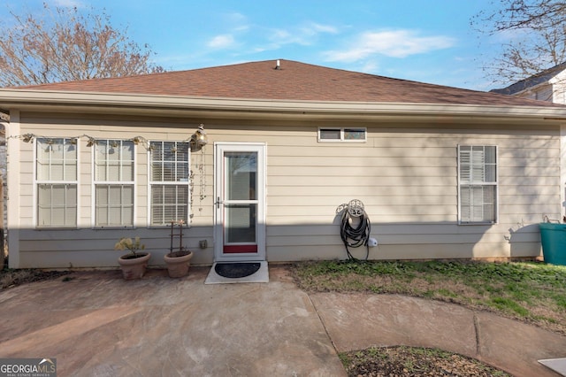 rear view of property featuring a patio