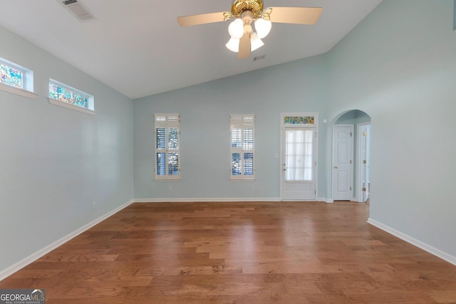 spare room with ceiling fan, lofted ceiling, and hardwood / wood-style floors