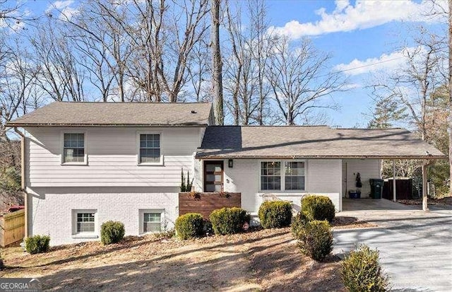 tri-level home featuring a carport