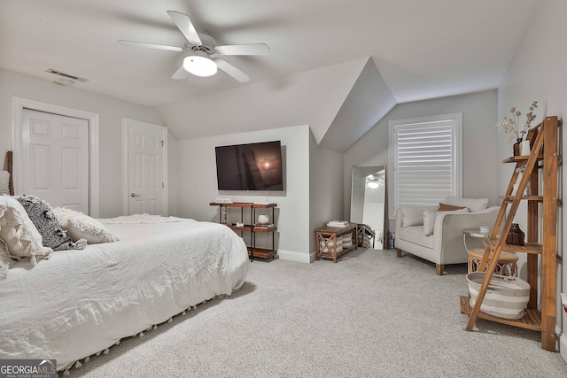 carpeted bedroom featuring vaulted ceiling and ceiling fan