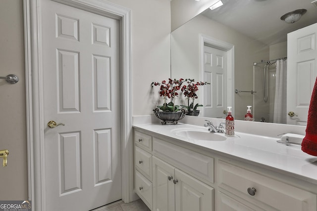 bathroom featuring vanity, tile patterned flooring, and a shower with curtain