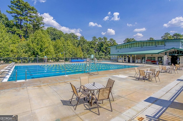 view of swimming pool featuring a patio