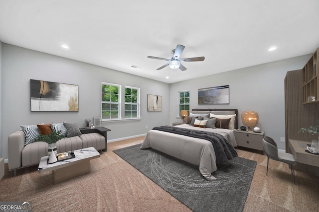 bedroom with ceiling fan and carpet floors