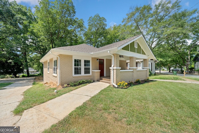 view of front of home featuring a porch and a front lawn