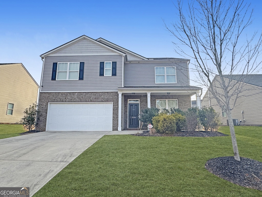 view of front facade featuring a front yard and a garage