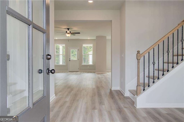 foyer featuring light wood-type flooring and ceiling fan