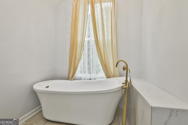 bathroom with a washtub