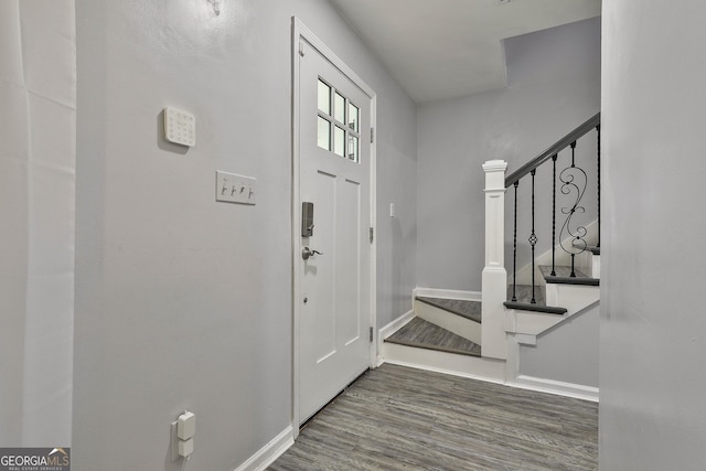 entryway with dark wood-type flooring