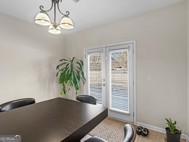 tiled office space featuring a notable chandelier and french doors