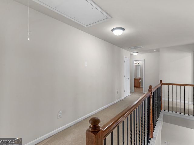 hallway featuring carpet flooring