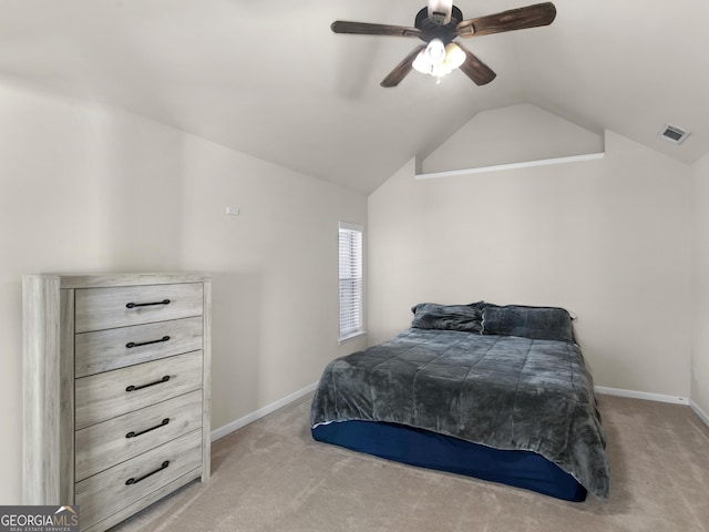 bedroom featuring ceiling fan, light colored carpet, and lofted ceiling