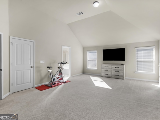 interior space featuring lofted ceiling and light colored carpet