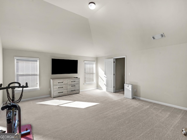 carpeted bedroom featuring lofted ceiling