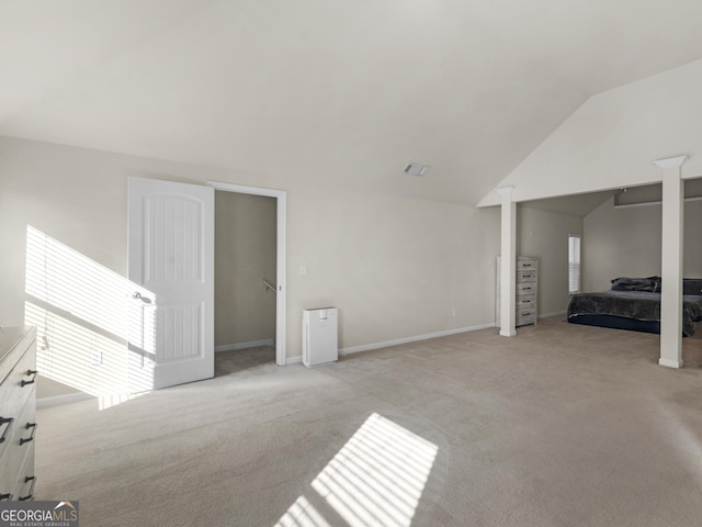 carpeted bedroom featuring vaulted ceiling