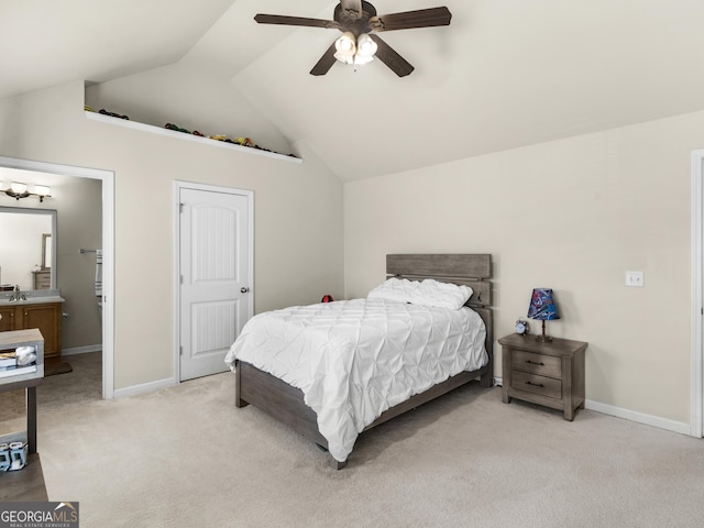 carpeted bedroom with lofted ceiling, sink, and ceiling fan