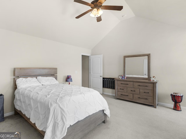 carpeted bedroom featuring ceiling fan and vaulted ceiling