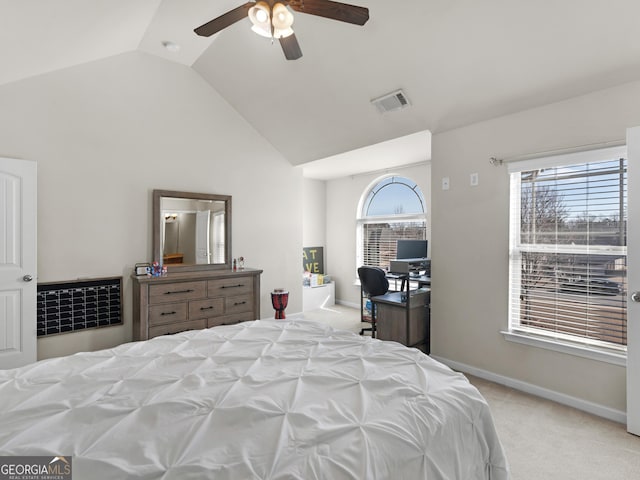 bedroom featuring lofted ceiling, light colored carpet, and ceiling fan