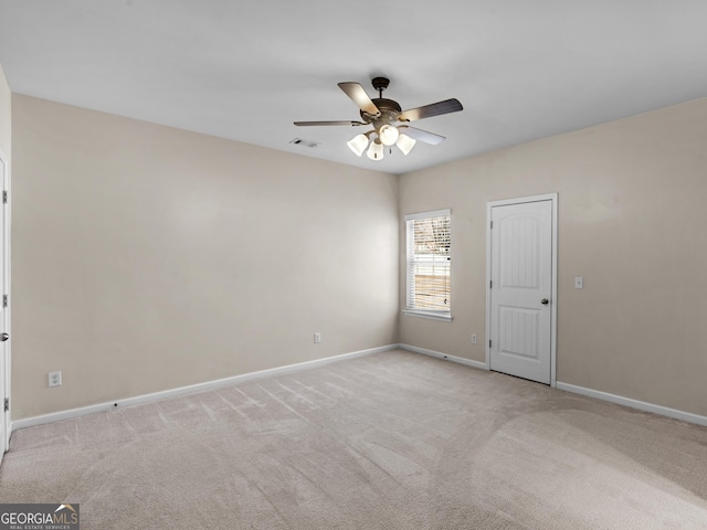 carpeted empty room with ceiling fan