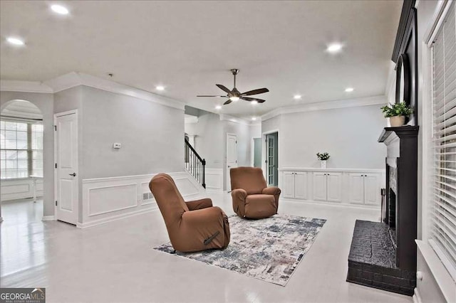 interior space featuring crown molding and ceiling fan