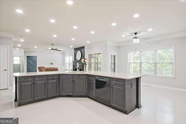 kitchen featuring sink, crown molding, gray cabinets, a kitchen island with sink, and black dishwasher