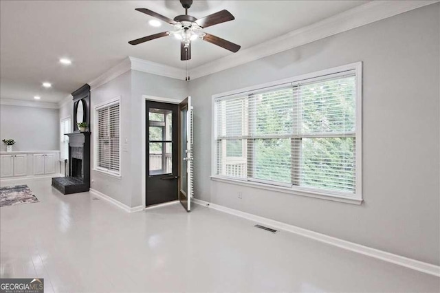 interior space with crown molding and ceiling fan