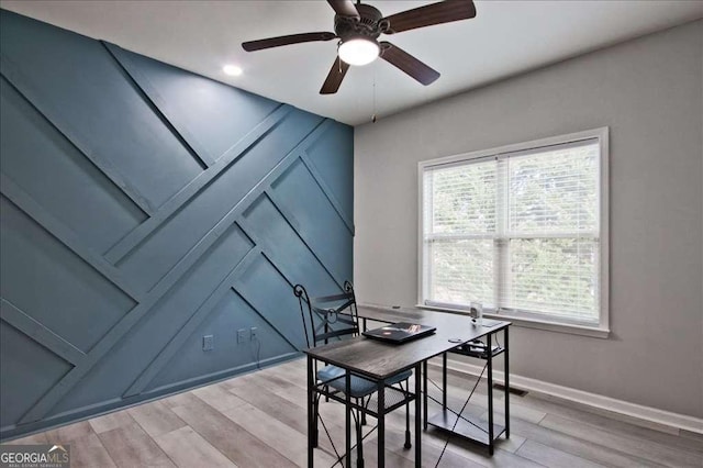 office space with wood-type flooring and ceiling fan