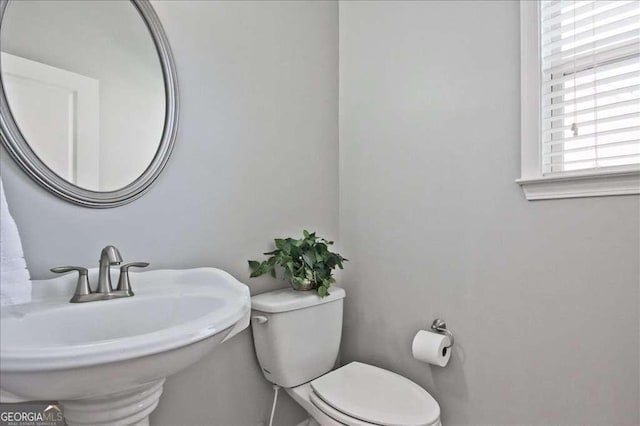 bathroom with sink and toilet