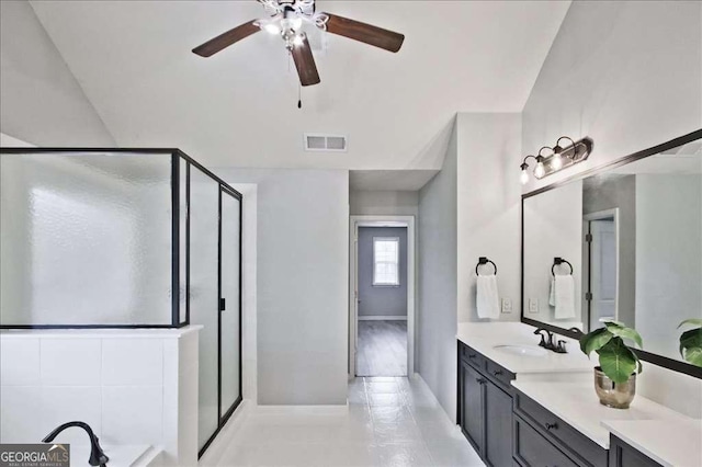 bathroom with ceiling fan, vanity, and independent shower and bath