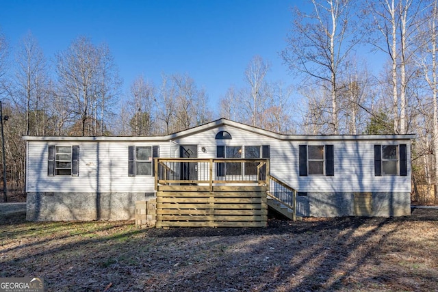 view of front of home featuring a wooden deck