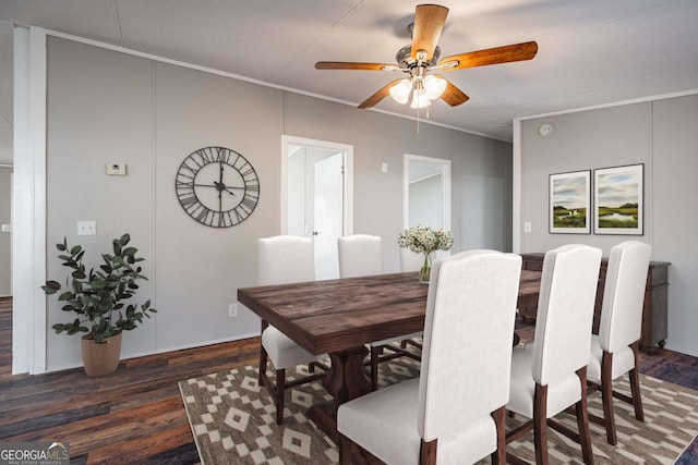 dining room with crown molding, ceiling fan, and dark hardwood / wood-style flooring