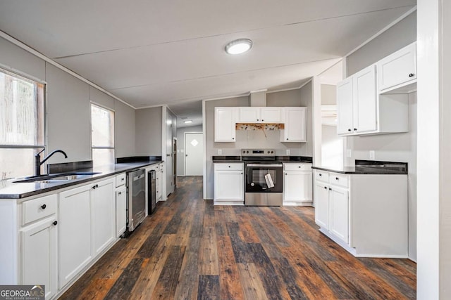 kitchen featuring white cabinetry, appliances with stainless steel finishes, sink, and dark hardwood / wood-style floors