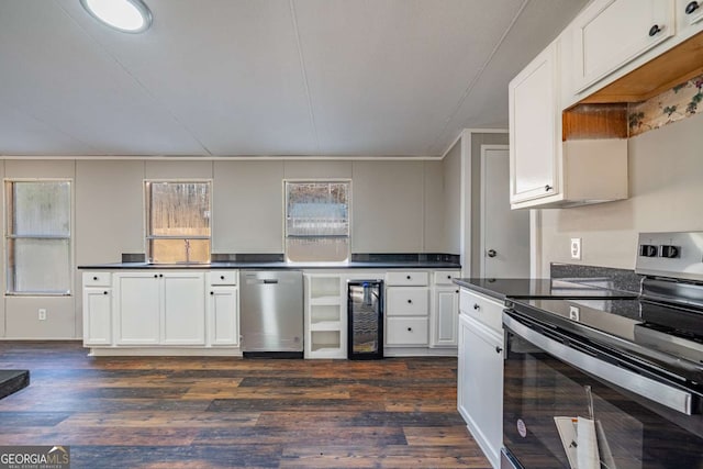 kitchen featuring wine cooler, dark wood-type flooring, white cabinets, and appliances with stainless steel finishes