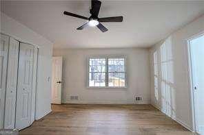 unfurnished room with wood-type flooring